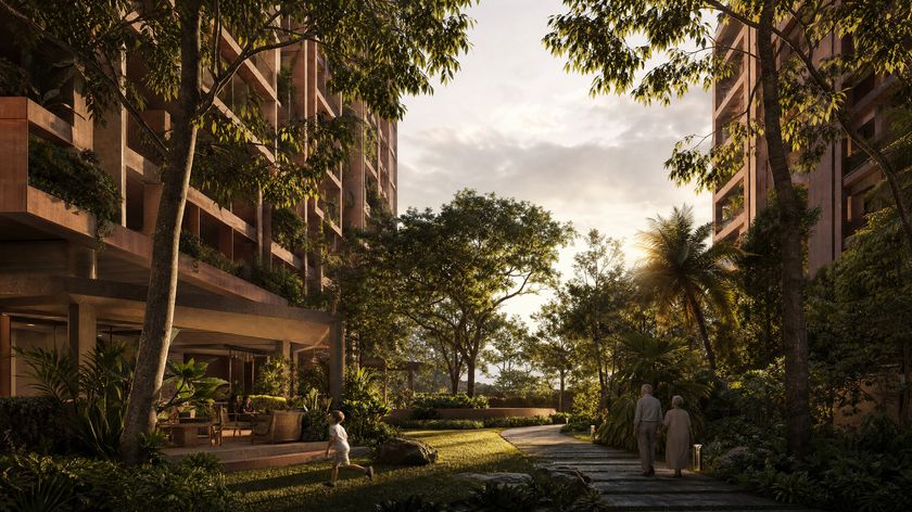 A landscaped garden courtyard between two residential towers, with residents walking and a child playing
