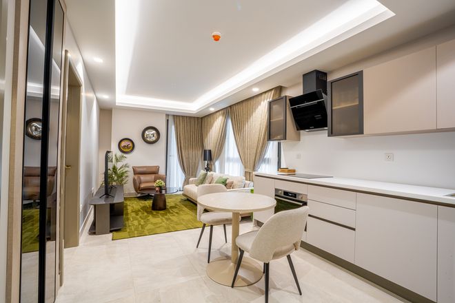 Living area of a furnished one-bedroom apartment at Grand Mirage