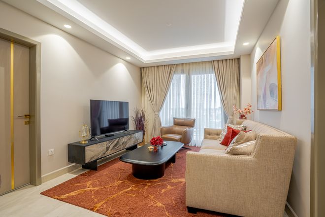 Living room of a furnished two-bedroom apartment at Grand Mirage