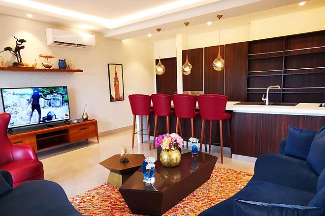Furnished living room inside Mirage Residence